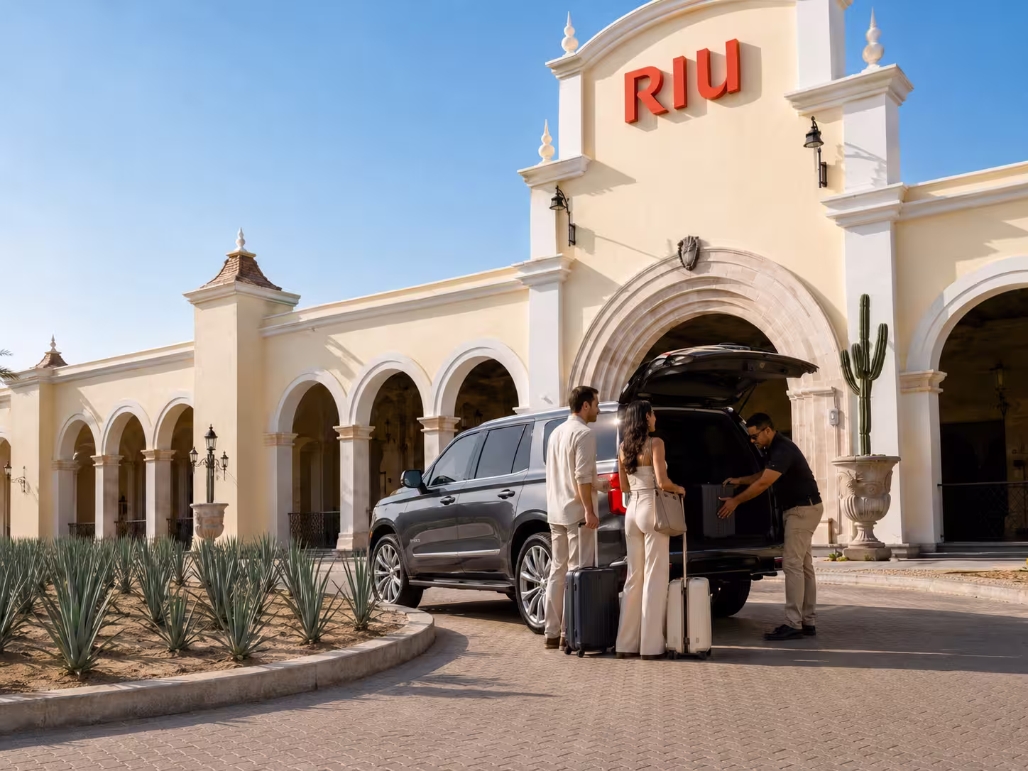 Driver loading luggage into a private vehicle for Riu Palace guests
